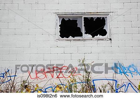 Building with broken windows and graffiti View Large Photo Image Stock Photograph - Building with broken windows and graffiti. Fotosearch