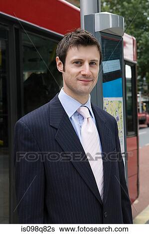 Businessman at bus stop View Large Photo Image Stock Photograph - Businessman at bus stop. Fotosearch