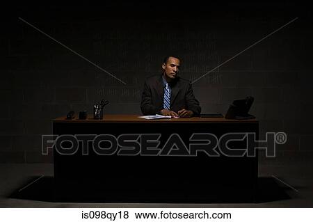 Businessman at desk View Large Photo Image Stock Photo - Businessman at desk. Fotosearch