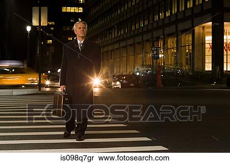 Businessman crossing the street View Large Photo Image Stock Photography - Businessman crossing the street. Fotosearch