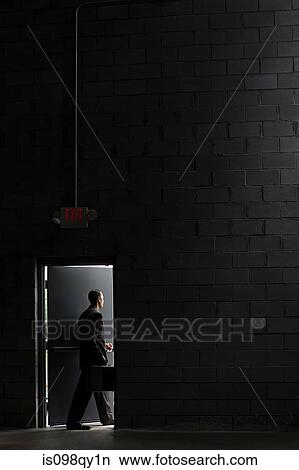 Businessman going through door View Large Photo Image Picture - Businessman going through door. Fotosearch