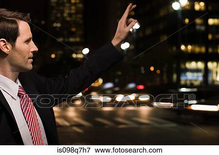 Stock Photo - Businessman hailing a cab. Fotosearch