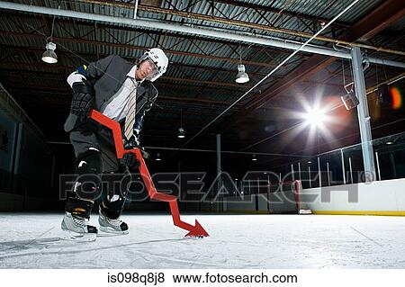 Businessman playing ice hockey View Large Photo Image Stock Photo - Businessman playing ice hockey. Fotosearch