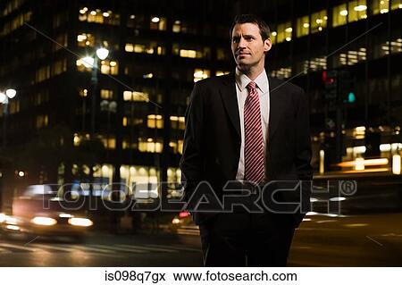 Stock Photo - Businessman standing near a busy road. Fotosearch
