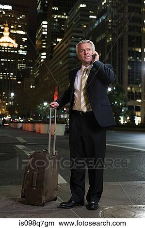 Picture - Businessman with a suitcase. Fotosearch