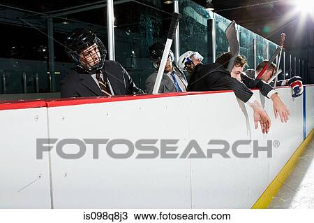 Businessmen at the edge of an ice rink View Large Photo Image Stock Image - Businessmen at the edge of an ice rink. Fotosearch