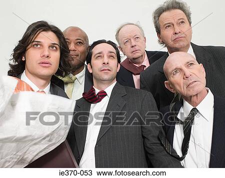 Stock Image - Businessmen in wind. Fotosearch