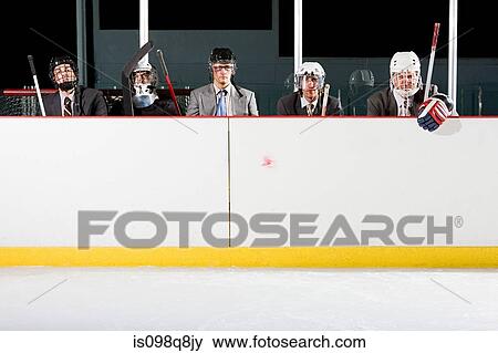Businessmen playing ice hockey View Large Photo Image Stock Photo - Businessmen playing ice hockey. Fotosearch