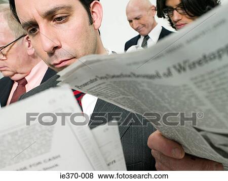 Businessmen reading newspapers View Large Photo Image Stock Photo - Businessmen reading newspapers. Fotosearch