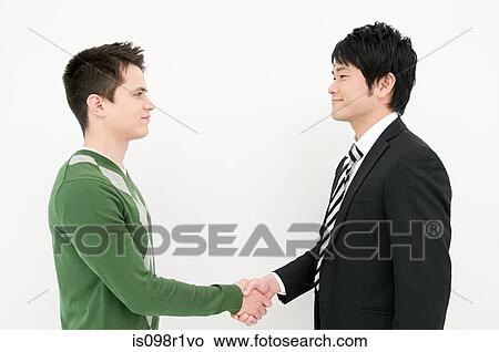 Picture - Businessmen shaking hands. Fotosearch