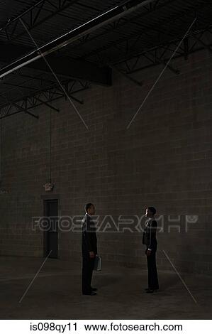 Businesspeople in warehouse View Large Photo Image Stock Image - Businesspeople in warehouse. Fotosearch