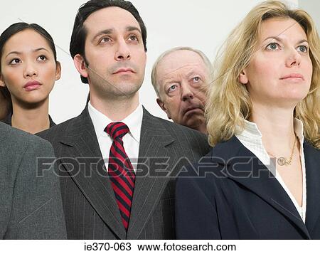 Stock Image - Businesspeople looking up. Fotosearch