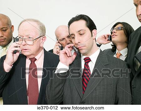 Businesspeople on cellphones View Large Photo Image Stock Image - Businesspeople on cellphones. Fotosearch