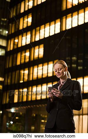Businesswoman text messaging View Large Photo Image Stock Image - Businesswoman text messaging. Fotosearch