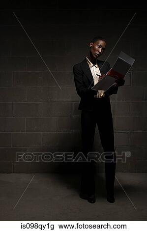 Stock Image - Businesswoman with folder. Fotosearch