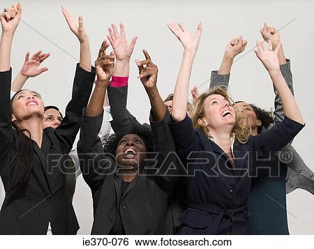 Businesswomen with arms raised View Large Photo Image Stock Photograph - Businesswomen with arms raised. Fotosearch
