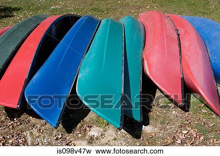 Canoes upside down in a row View Large Photo Image Stock Photo - Canoes upside down in a row. Fotosearch