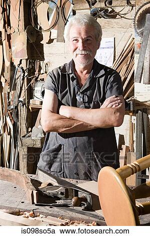 Stock Image - Carpenter in workshop. Fotosearch