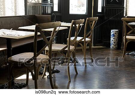 Stock Photography - Chairs and tables in empty cafe. Fotosearch