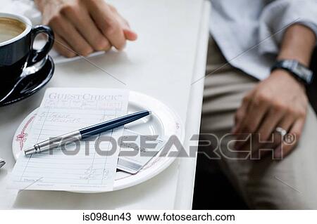 Check on plate at cafe View Large Photo Image Stock Image - Check on plate at cafe. Fotosearch