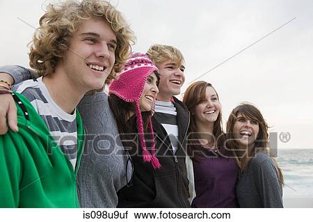 Stock Image - Cheerful young friends together. Fotosearch