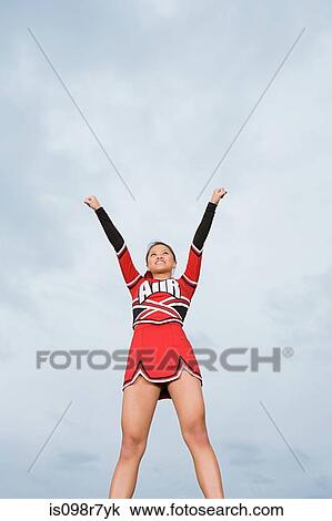 Cheerleader with arms raised View Large Photo Image Stock Image - Cheerleader with arms raised. Fotosearch