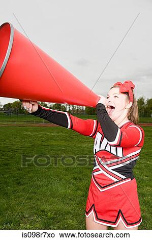 Picture - Cheerleader with megaphone. Fotosearch