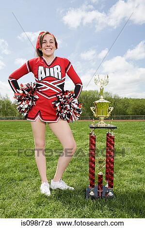 Cheerleader with trophy View Large Photo Image Stock Photo - Cheerleader with trophy. Fotosearch