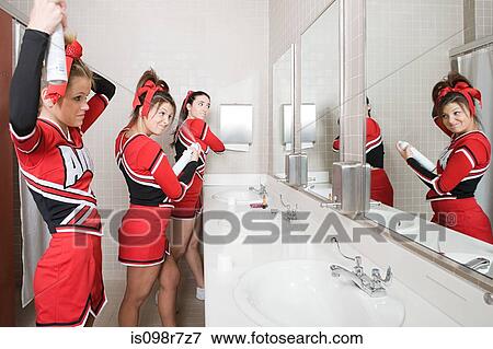 Stock Photo - Cheerleaders in restroom. Fotosearch