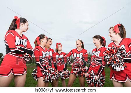 Stock Image - Cheerleaders laughing. Fotosearch