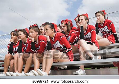 Stock Image - Cheerleaders on bleachers. Fotosearch