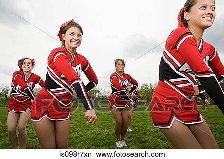 Cheerleaders performing routine View Large Photo Image Picture - Cheerleaders performing routine. Fotosearch
