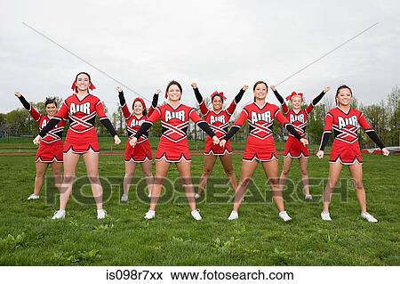 Cheerleaders performing routine View Large Photo Image Stock Photo - Cheerleaders performing routine. Fotosearch