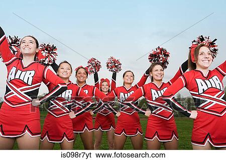 Cheerleaders performing routine View Large Photo Image Stock Photograph - Cheerleaders performing routine. Fotosearch
