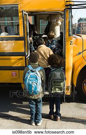Children boarding school bus View Large Photo Image Stock Image - Children boarding school bus. Fotosearch
