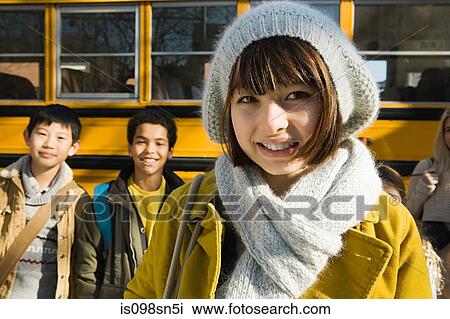 Stock Image - Children by school bus. Fotosearch