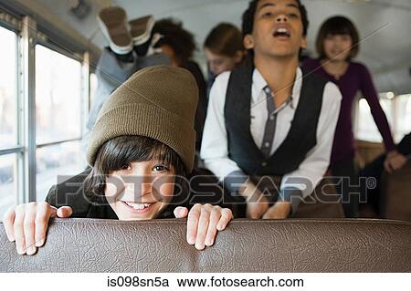 Stock Image - Children on school bus. Fotosearch