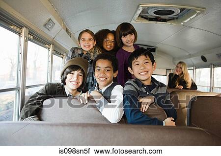 Stock Image - Children on school bus. Fotosearch