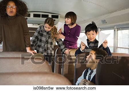 Stock Photo - Children on school bus. Fotosearch