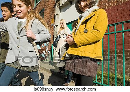 Stock Photo - Children outside school. Fotosearch