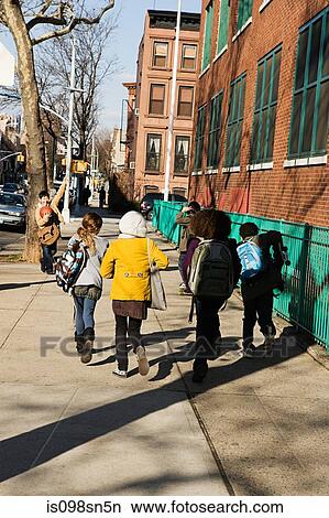 Picture - Children walking to school. Fotosearch