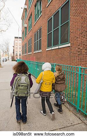 Stock Photograph - Children walking to school. Fotosearch