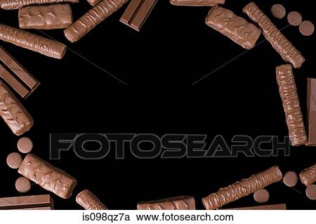 Chocolate biscuits on a black background View Large Photo Image Stock Image - Chocolate biscuits on a black background. Fotosearch