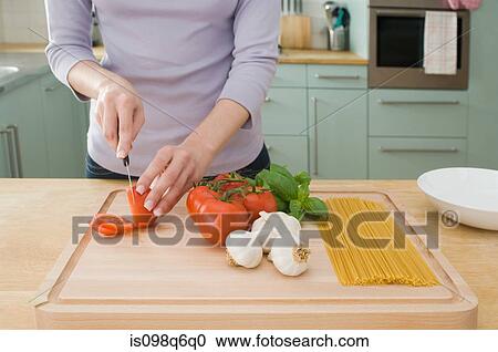 Chopping tomatoes View Large Photo Image Stock Image - Chopping tomatoes. Fotosearch