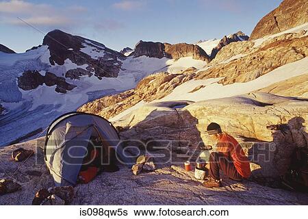 Stock Photograph - Climber and tent at north cascades national park. Fotosearch