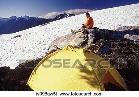 Stock Photograph - Climber and tent at north cascades national park. Fotosearch