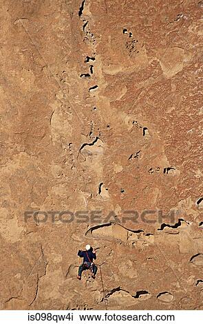 Stock Image - Climber on morning glory wall. Fotosearch