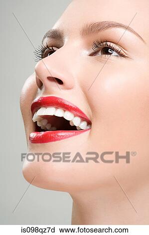 Stock Image - Close up of a laughing woman. Fotosearch