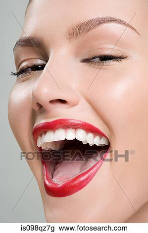 Stock Image - Close up of a laughing woman. Fotosearch