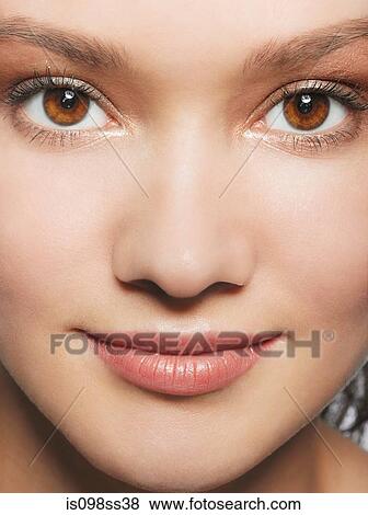 Stock Photo - Close up of young woman's face. Fotosearch